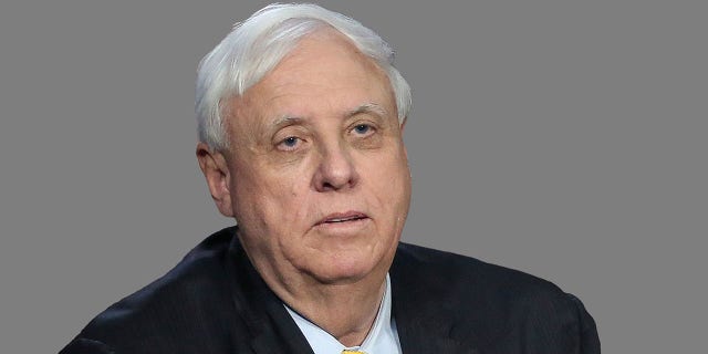 Jim Justice headshot, as West Virginia governor, graphic element on gray