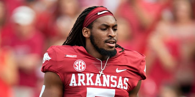 Joe Foucha, #7 of the Arkansas Razorbacks, runs onto the field before a game against the Texas Longhorns at Donald W. Reynolds Stadium on Sept. 11, 2021, in Fayetteville, Arkansas.  The Razorbacks defeated the Longhorns 21-40.