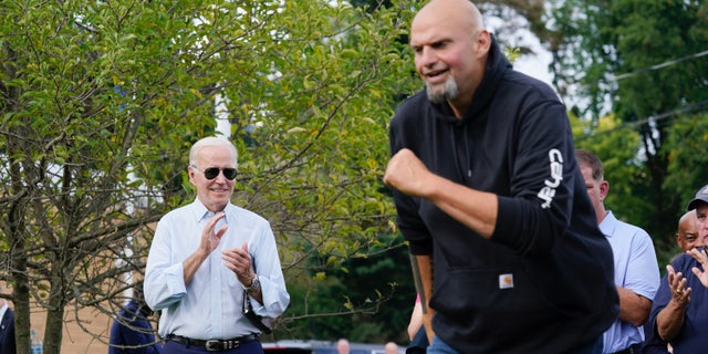 President Joe Biden watches as Democratic Pa. Lt. Gov. John Fetterman takes the stage at a United Steelworkers of America Local Union 2227 event in West Mifflin, Pa., Monday, Sept. 5, 2022, to honor workers on Labor Day. (AP Photo/Susan Walsh)