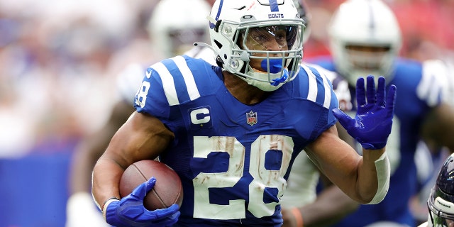 Jonathan Taylor of the Indianapolis Colts takes the ball against the Houston Texans at NRG Stadium on September 11, 2022 in Houston.