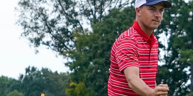 Jordan Spieth reacts to his chip to the fifth green during their singles match at the Presidents Cup golf tournament at the Quail Hollow Club, Sunday, Sept. 25, 2022, in Charlotte, N.C.