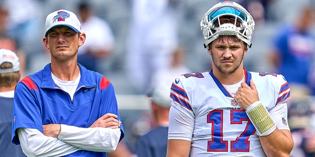 Then-Buffalo Bills quarterbacks coach Ken Dorsey and quarterback Josh Allen, #17, look on during a preseason game between the Chicago Bears and the Buffalo Bills on Aug. 21, 2021 at Soldier Field in Chicago.