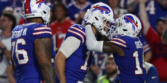Stefon Diggs #14 of the Buffalo Bills celebrates with teammate Josh Allen #17 after scoring a touchdown against the Tennessee Titans during the third quarter of the game at Highmark Stadium on September 19, 2022 in Orchard Park, New York.