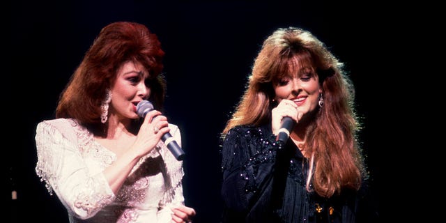 The Judds (pictured in 1991,) with Naomi Judd (left) and daughter Wynonna, earned 14 No. 1 singles and five Grammy Awards in the '80s and early '90s.  Chicago, Illinois, February 1, 1991. 