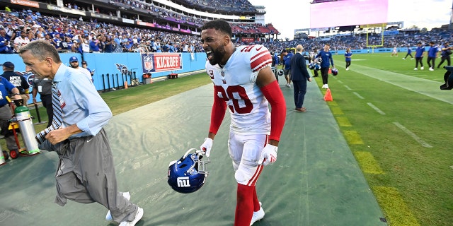 New York Giants safety Julian Love, #20, celebrates after the Giants defeated the Tennessee Titans 21-20 in an NFL football game Sunday, Sept. 11, 2022, in Nashville, Tennessee.