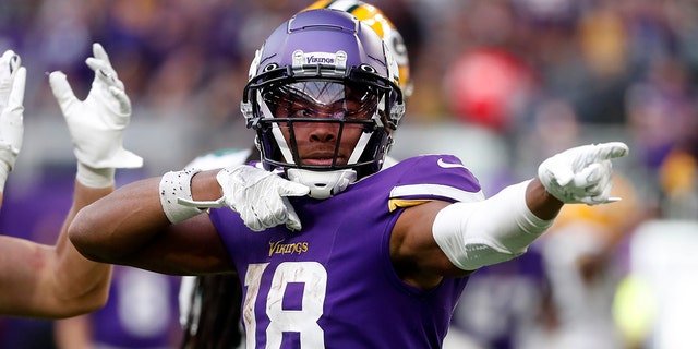 Minnesota Vikings wide receiver Justin Jefferson, #18, celebrates after catching a pass for a first down during the second half of an NFL football game against the Green Bay Packers, Sunday, Sept. 11, 2022, in Minneapolis. 