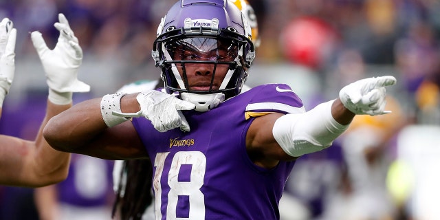 Minnesota Vikings wide receiver Justin Jefferson, #18, celebrates after catching a pass for a first down during the second half of an NFL football game against the Green Bay Packers, Sunday, Sept. 11, 2022, in Minneapolis.