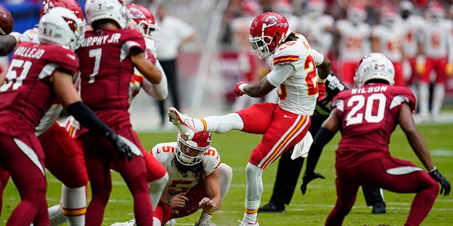 Kansas City Chiefs safety Justin Reid kicks an extra point against the Cardinals on Sunday, Sept. 11, 2022 in Glendale, Arizona.