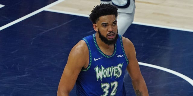 Karl-Anthony Towns #32 of the Minnesota Timberwolves watches during a game against the Memphis Grizzlies during Game 6 of Game 1 of the 2022 NBA Playoffs at the Target Center in Minneapolis, Minnesota on April 29, 2022.