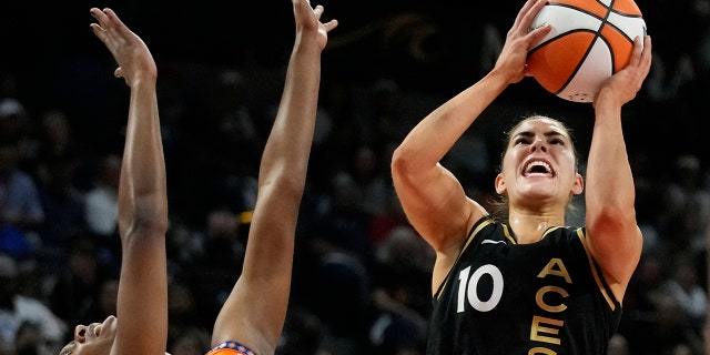 Las Vegas Aces guard Kelsey Plum, #10, shoots at Connecticut Sun guard Nia Clauden, #11, during the first half of Game 2 of the WNBA Basketball Finals playoff series on Tuesday, September 13, 2022 in Las Vegas.