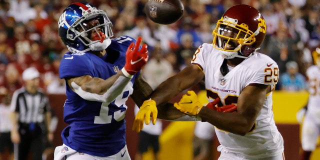 New York Giants wide receiver Kenny Golladay, #19, attempts to make a catch as Washington Football Team cornerback Kendall Fuller, #29, defends in the third quarter at FedExField in Landover, Maryland, Sept. 16, 2021.
