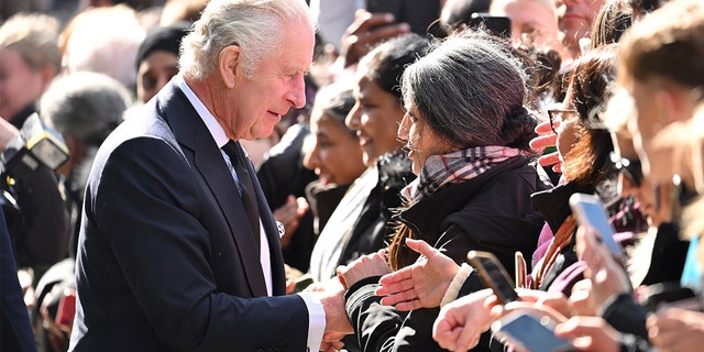 King Charles III greets members of the public queueing to see the lying in state of Queen Elizabeth II along the river Thames at Lambeth. on Sept. 17, 2022 in London.