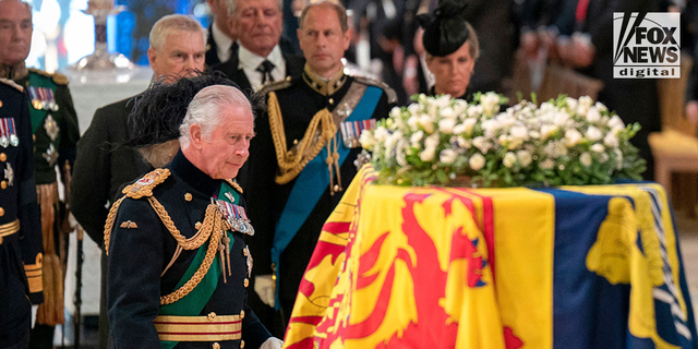 King Charles III overlooks the coffin of Queen Elizabeth II.