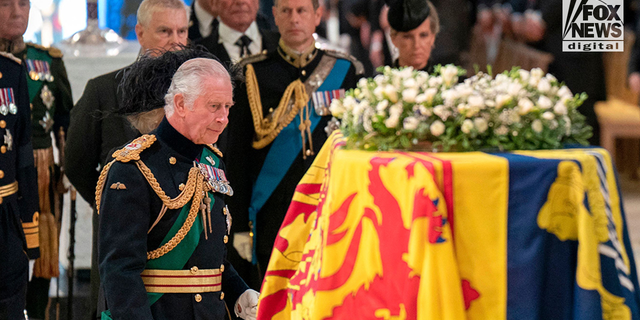 King Charles III overlooks the coffin of Queen Elizabeth II.