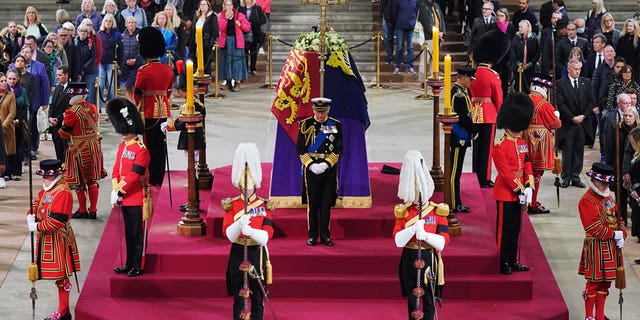 King Charles III, Anne, Princess Royal, Prince Andrew, Duke of York and Edward, Earl of Wessex hold a vigil beside the coffin of their mother, Queen Elizabeth II, as it lies in state on the catafalque of Westminster Hall.