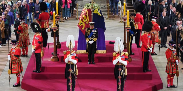 King Charles III, center, and other members of the royal family hold a vigil beside the coffin of Queen Elizabeth II as it lies in state on the catafalque in Westminster Hall.