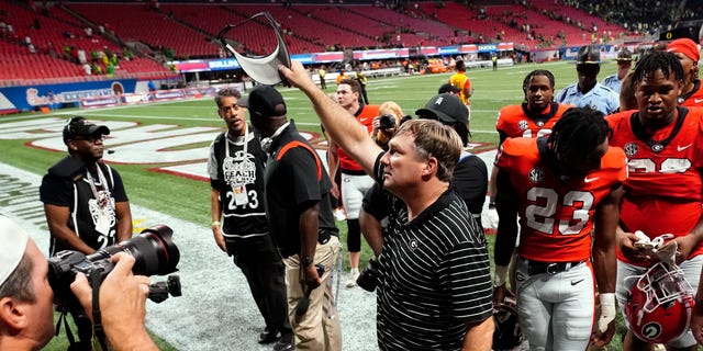 Georgia head coach Kirby Smart waves to the crowd as he leaves the field after defeating Oregon on Sept. 3, 2022, in Atlanta.