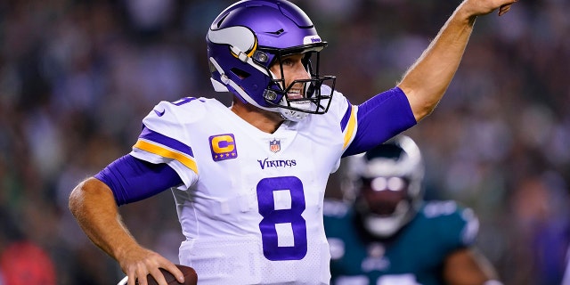 Minnesota Vikings quarterback Kirk Cousins (8) signals a teammate during the second half of an NFL football game against the Philadelphia Eagles, Monday, Sept. 19, 2022, in Philadelphia.
