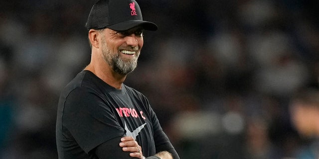 Liverpool's manager Jurgen Klopp smiles during his team's warm up before the group A Champions League soccer match between Napoli and Liverpool at the Diego Armando Maradona stadium in Naples, Italy, Wednesday, Sept. 7, 2022.