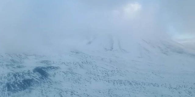 A view from a rescue helicopter shows the Klyuchevskaya Sopka volcano following an accident involving a tourist group of climbers on the far eastern Kamchatka Peninsula, Russia, September 4, 2022, in this still image taken from video.