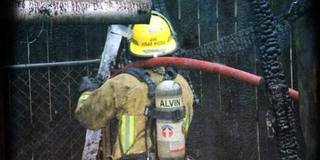 Alvin Volunteer Fire Department Capt. Charles Krampota is seen participating in a training exercise in a picture dated March 1, 2013.
