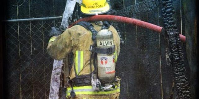 Alvin Volunteer Fire Department Capt. Charles Krampota is seen participating in a training exercise in a picture dated March 1, 2013.