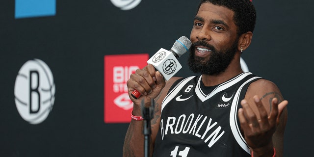 Brooklyn Nets guard Kyrie Irving (11) talks to the media during media day at HSS Training Center.