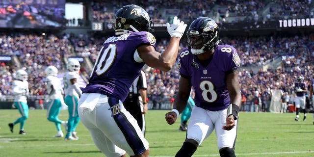 Wide receiver Demarcus Robinson #10 of the Baltimore Ravens celebrates with quarterback Lamar Jackson #8 after catching a touchdown pass against the Miami Dolphins at M&amp;T Bank Stadium on Sept. 18, 2022 in Baltimore, Maryland.