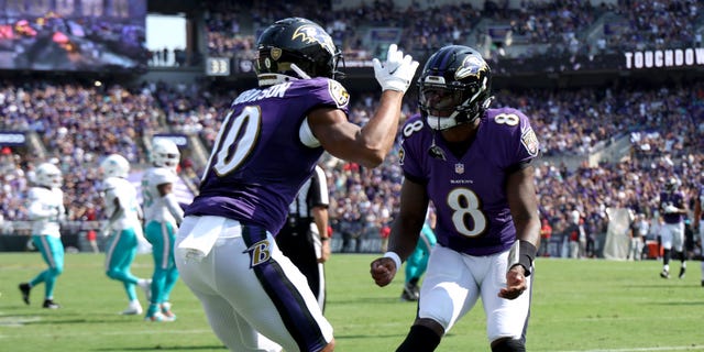 Wide receiver Demarcus Robinson #10 of the Baltimore Ravens celebrates with quarterback Lamar Jackson #8 after catching a touchdown pass against the Miami Dolphins at M&T Bank Stadium on Sept. 18, 2022 in Baltimore, Maryland.