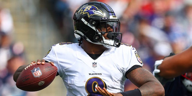 Baltimore Ravens quarterback Lamar Jackson attempts a second-half pass against the New England Patriots at Gillette Stadium in Foxborough, Massachusetts on September 25, 2022.