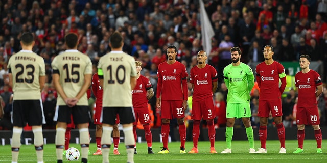 Players of Liverpool observe a minute silence to pay tribute to Her Majesty Queen Elizabeth II, who died away at Balmoral Castle on September 8, 2022, prior to the UEFA Champions League group.