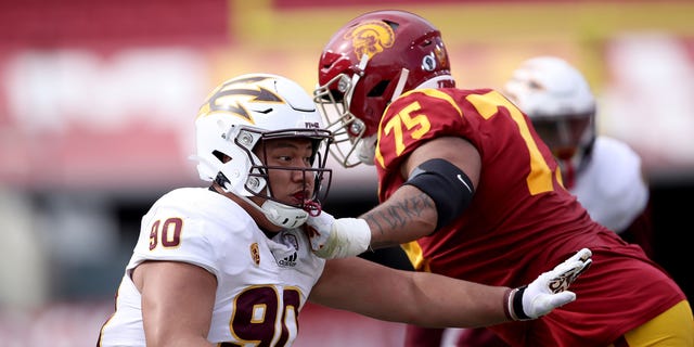 Jermayne Lole of the Arizona State Sun Devils pushes off Alijah Vera-Tucker of the USC Trojans during the second half of a game at the Los Angeles Coliseum in Los Angeles, California, on Nov. 7, 2020.