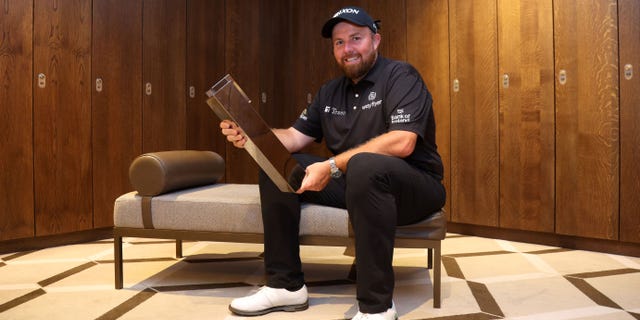 Shane Lowry poses with the BMW PGA Championship trophy at Wentworth Golf Club on Sept. 11, 2022, in Virginia Water, England.