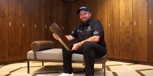 Shane Lowry poses with the BMW PGA Championship trophy at Wentworth Golf Club on Sept. 11, 2022, in Virginia Water, England.