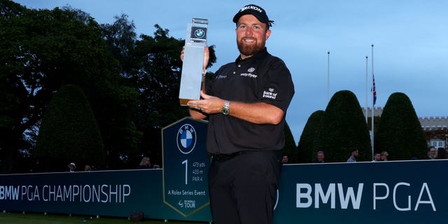 Shane Lowry poses with the BMW PGA Championship trophy after winning the tournament during the BMW PGA Championship on Sept. 11, 2022.