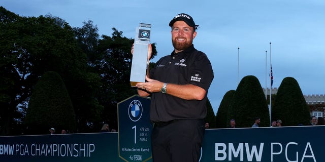 Shane Lowry poses with the BMW PGA Championship trophy after winning the tournament during the BMW PGA Championship on Sept. 11, 2022.