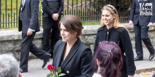 Princess Eugenie carried a red rose as she walked with Princess Beatrice. 