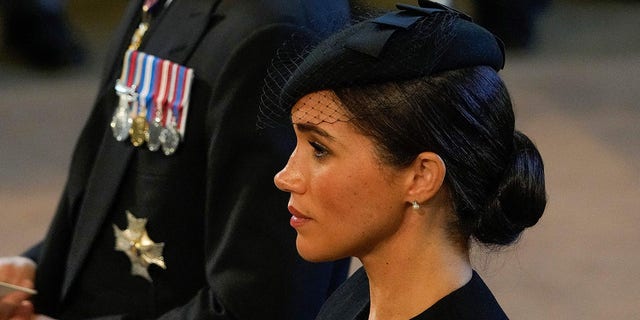 Britain's Prince Harry, Duke of Sussex and Meghan, Duchess of Sussex attend a service for the reception of Queen Elizabeth II's coffin at Westminster Hall, in the Palace of Westminster in London on September 14, 2022.