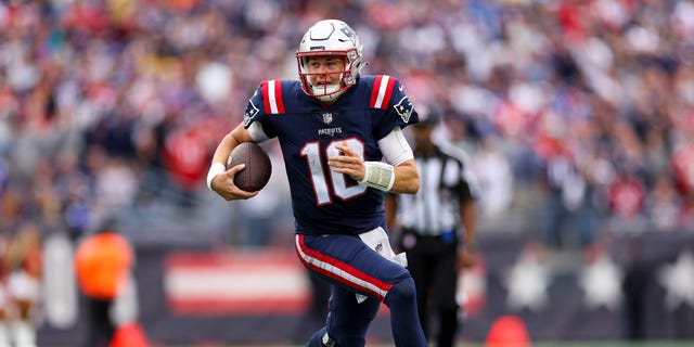 Quarterback Mac Jones of the New England Patriots runs the ball during the second half against the Baltimore Ravens at Gillette Stadium in Foxborough, Massachusetts, on Sept. 25, 2022.
