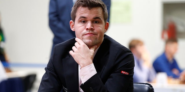 Magnus Carlsen of Norway plays against Adam Tukhaev of Ukraine.