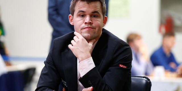Magnus Carlsen of Norway plays against Adam Tukhaev of Ukraine.