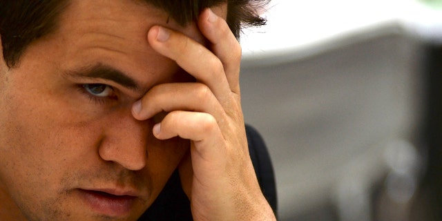 Norways Magnus Carlsen gestures during his Round 8 game against the Slovakia team at the 44th Chess Olympiad 2022, in Mahabalipuram on Aug. 6, 2022.