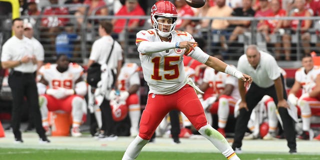 Quarterback Patrick Mahomes #15 of the Kansas City Chiefs completes a pass during the third quarter of the game against the Arizona Cardinals at State Farm Stadium on September 11, 2022 in Glendale, Arizona.