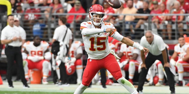 Quarterback Patrick Mahomes #15 of the Kansas City Chiefs completes a pass during the third quarter of the game against the Arizona Cardinals at State Farm Stadium on September 11, 2022 in Glendale, Arizona.