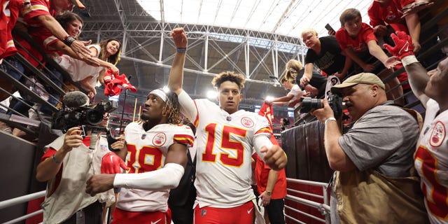 Cornerback L'Jarius Sneed #38 and quarterback Patrick Mahomes #15 of the Kansas City Chiefs walk off the field after the game against the Arizona Cardinals at State Farm Stadium on September 11, 2022 in Glendale, Arizona. The Chiefs won 44-21.