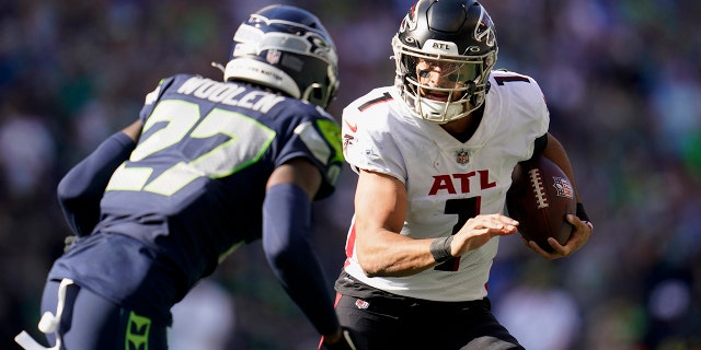 Atlanta Falcons quarterback Marcus Mariota runs with the ball during the second half of a game against the Seattle Seahawks Sept. 25, 2022 in Seattle.