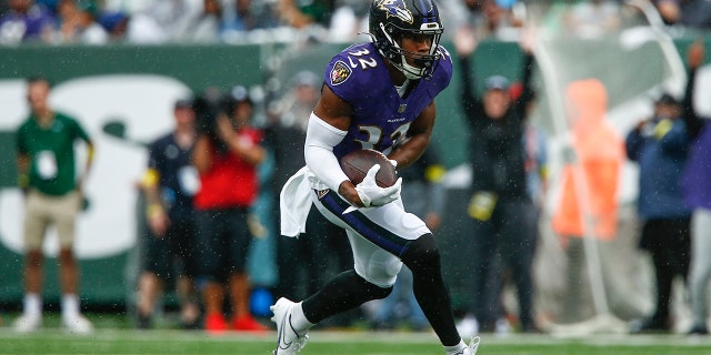 Marcus Williams (32) of the Baltimore Ravens makes a first half interception against the New York Jets in East Rutherford, New Jersey on September 11, 2022.