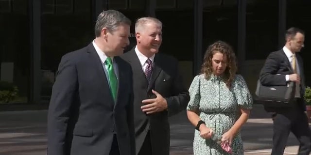 Pro-life activist Mark Houck, second from left, leaves federal court in Philadelphia after pleading not guilty to two counts associated with an alleged attack of an escort outside an abortion clinic in 2021.