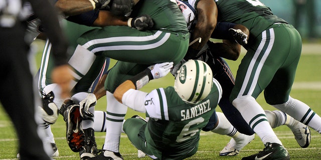 New York Jets quarterback Mark Sanchez, #6, fumbled in the first half when the New York Jets played the New England Patriots.