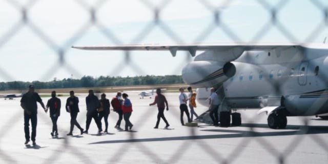 Migrants arrive at Martha's Vineyard Airport on Wednesday, Sept. 14, 2022.